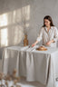 Woman setting a table with a neutral color palette